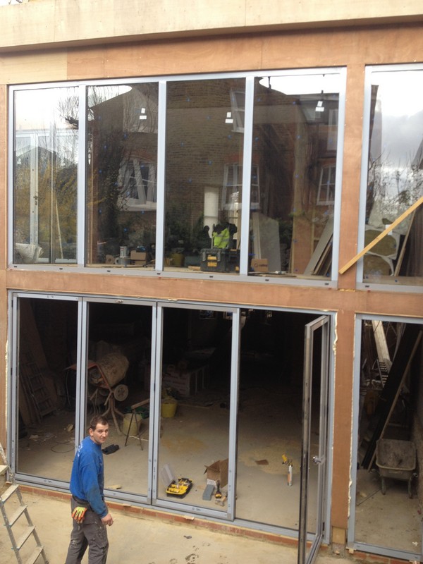 Aluminium bi-fold doors with two-storey glazing in Crouch End