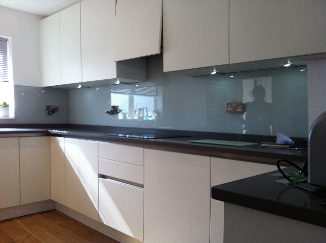Grey glass kitchen splashback with LED lighting in Crouch End