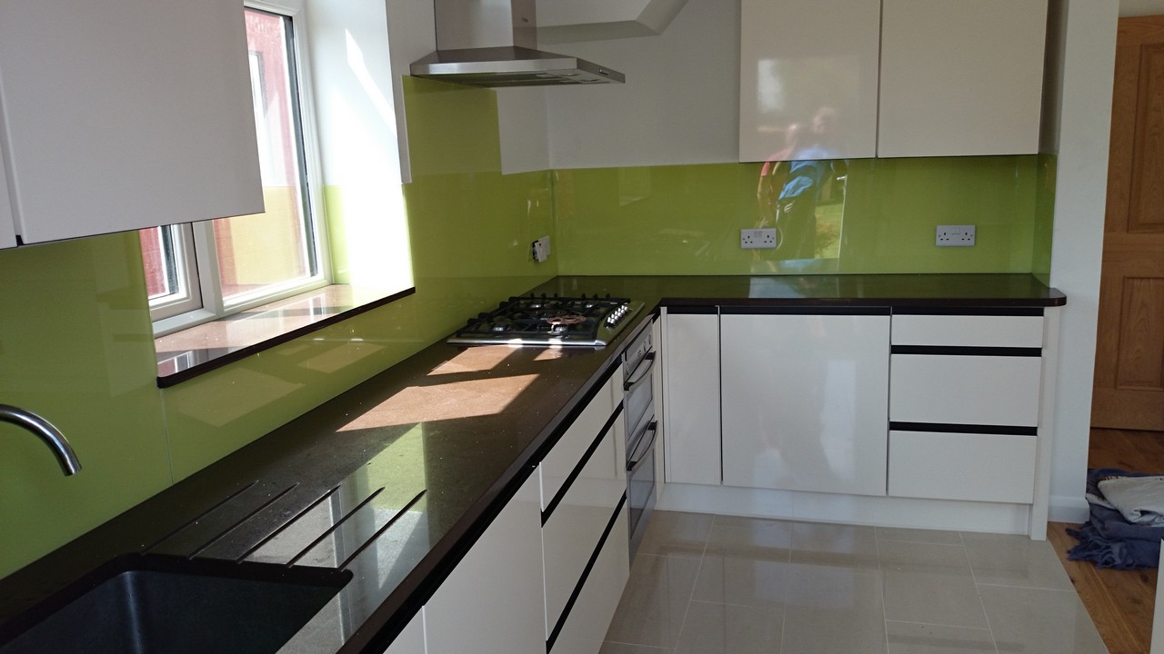 Lime green glass kitchen splashback installed by Crouch End glaziers
